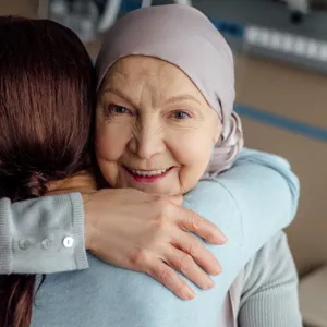 A woman hugging a man